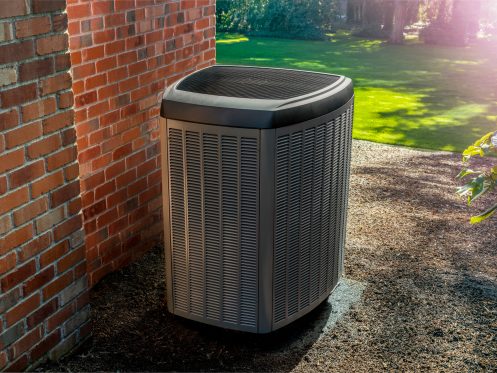 Residential condenser unit in the springtime