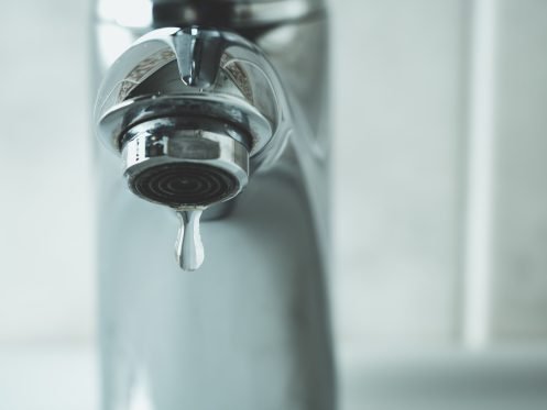 Closeup leaking faucet